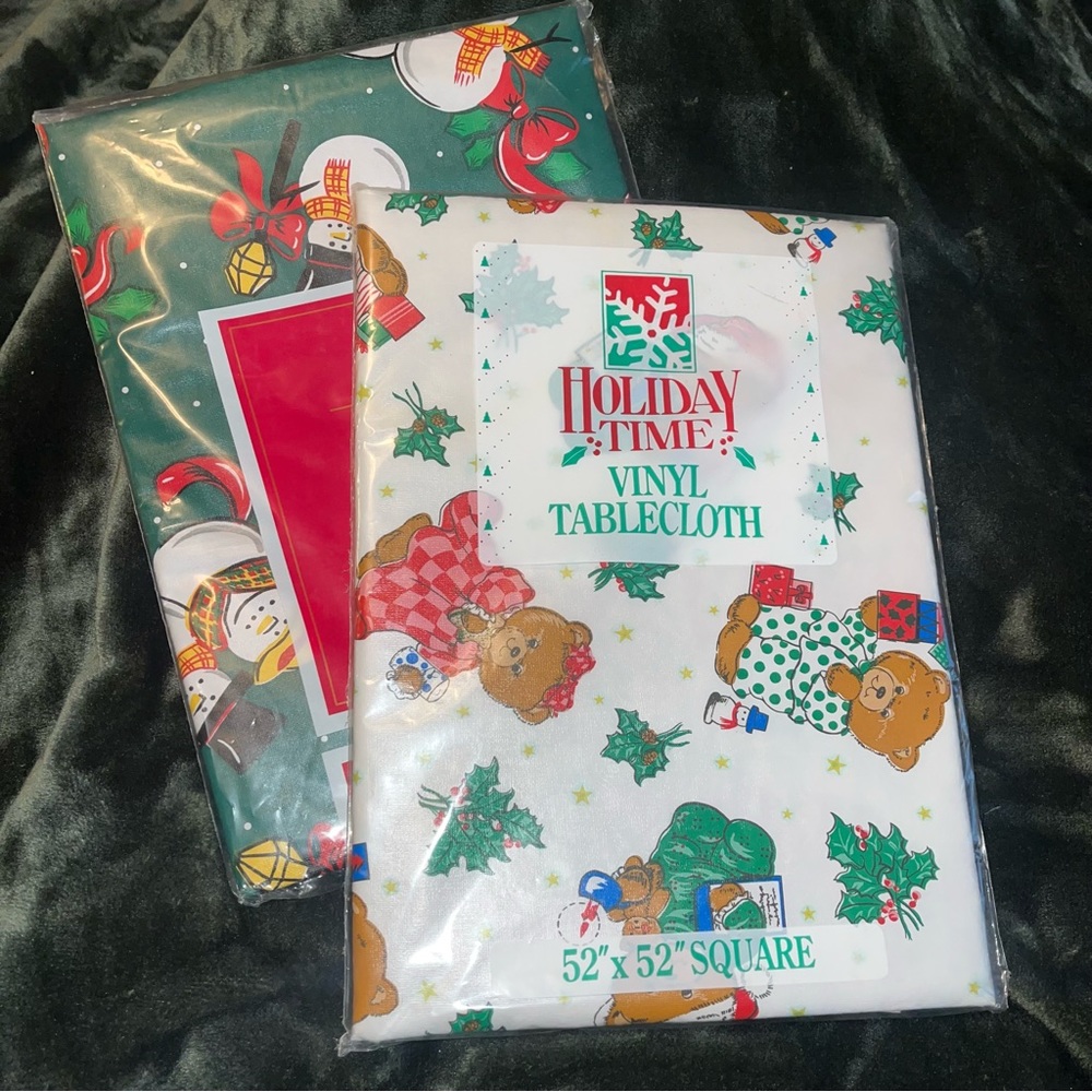 NEW old stock Holiday time vinyl tablecloths set of two! Christmas prints